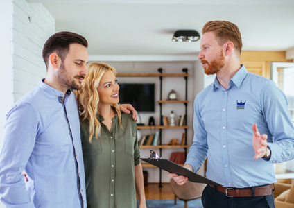 A friendly Storage King consultant holds a clipboard while providing a professional in-home appraisal for a couple in their Melbourne home. This expert consultation helps them find the perfect self storage solution and takes the guesswork out of choosing the right size unit.