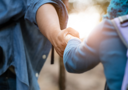 A touching photo of two people holding hands, representing our brand values in action. This symbolises that beyond being storage experts, Storage King is a socially responsible company deeply committed to giving back and supporting the local communities we serve across Australia.