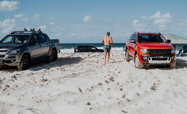 Enjoy your cars without the clutter at home. A person stands on a beach between their two vehicles, a lifestyle made possible by using secure car storage. Storage King has the expertise to provide trusted, professional protection for your second car, classic car, or recreational vehicle at our self-storage locations nationwide.